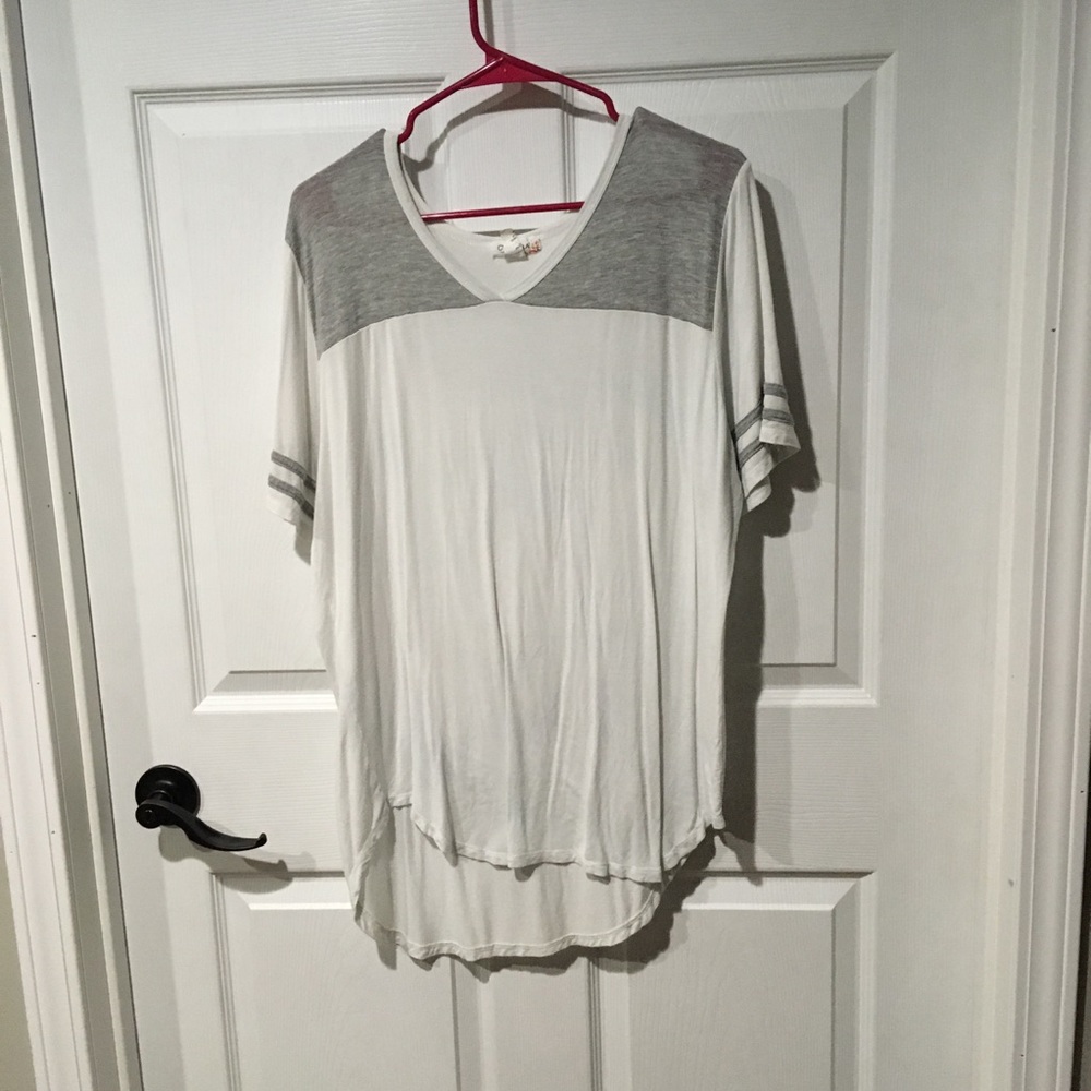 White and Grey T-Shirt with a long cut.